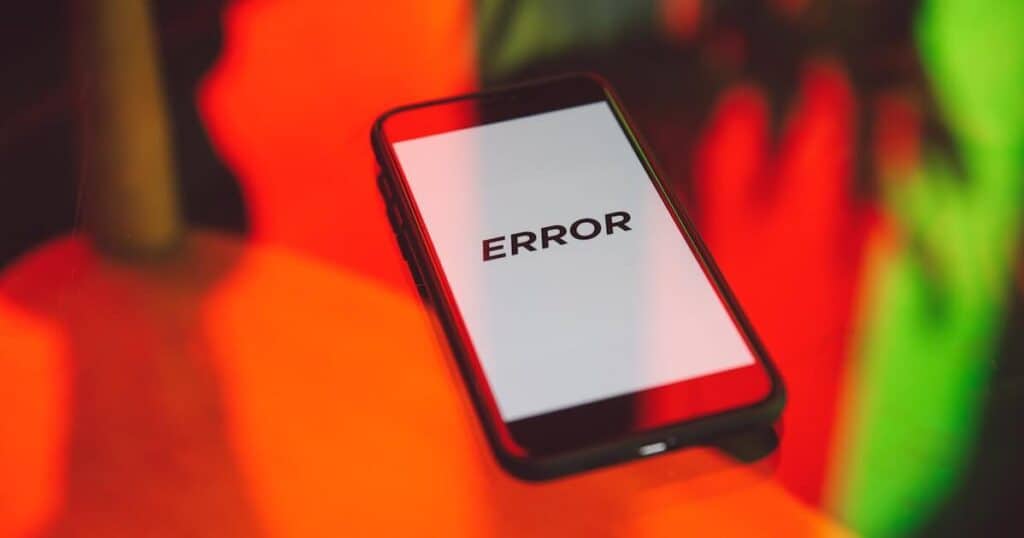 Mobile phone with the word error written in large letters across the screen