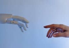 Robot hand and human hand reaching out to each other