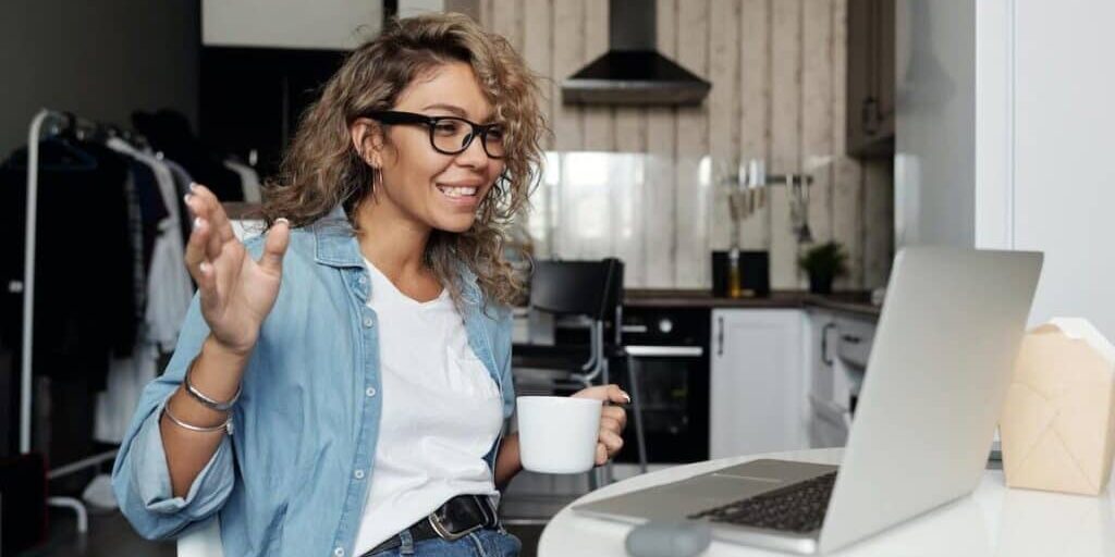 Woman joining a Google Meet call from home